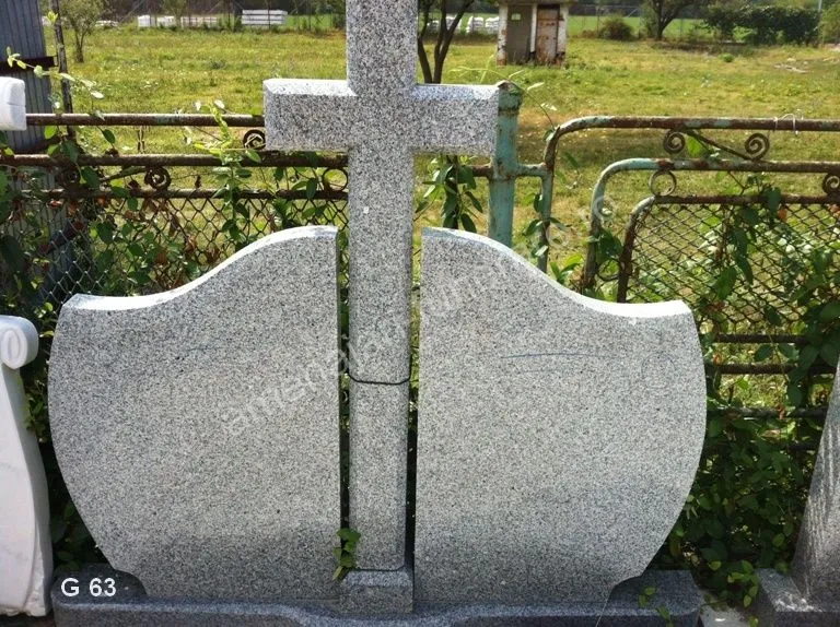 Monument cu cruce și forme ondulate - executat în granit la amenajari-funerare.ro