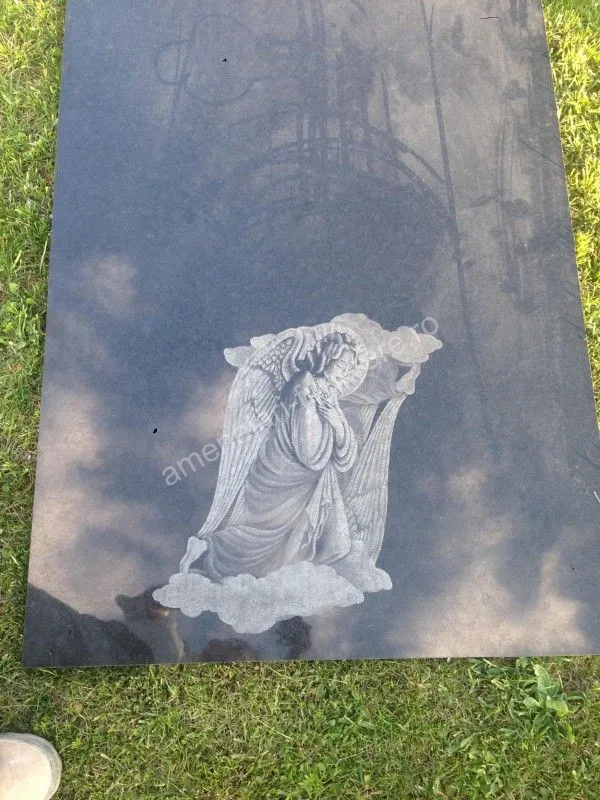 Portret de înger gravat pe granit negru - executat în granit la amenajari-funerare.ro